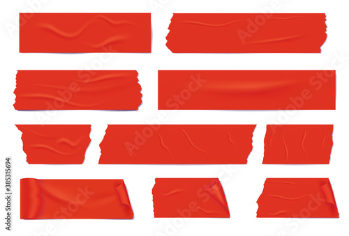 Slices of a red adhesive tape with shadow and wrinkles.