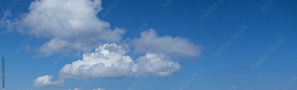 Image of a partly cloudy and partly clear sky during the day Image of a partly cloudy and partly clear sky during the day