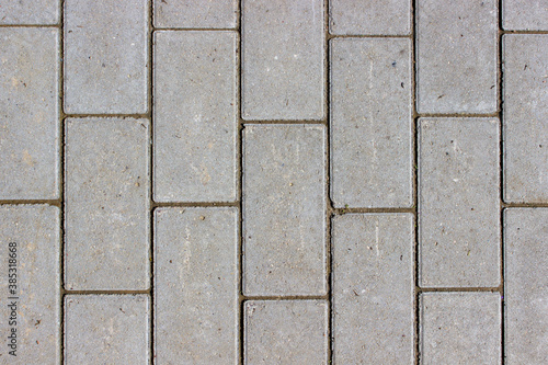 Clean newly layed grey rectangle pavement tiles background texture
