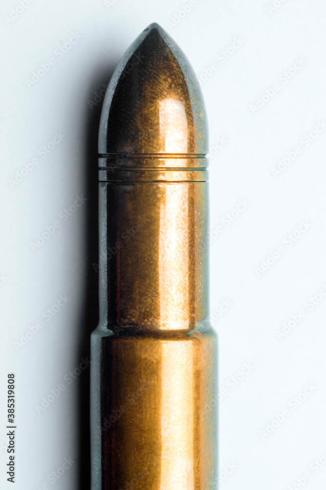 Machine gun cartridge on a white background Machine gun cartridge on a white background