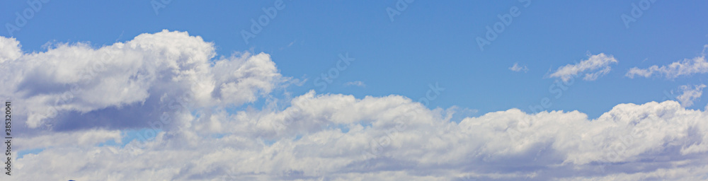 Image of a partly cloudy and partly clear sky during the day Image of a partly cloudy and partly clear sky during the day