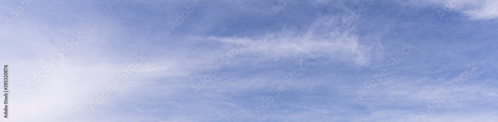 Image of a partly cloudy and partly clear sky during the day Image of a partly cloudy and partly clear sky during the day