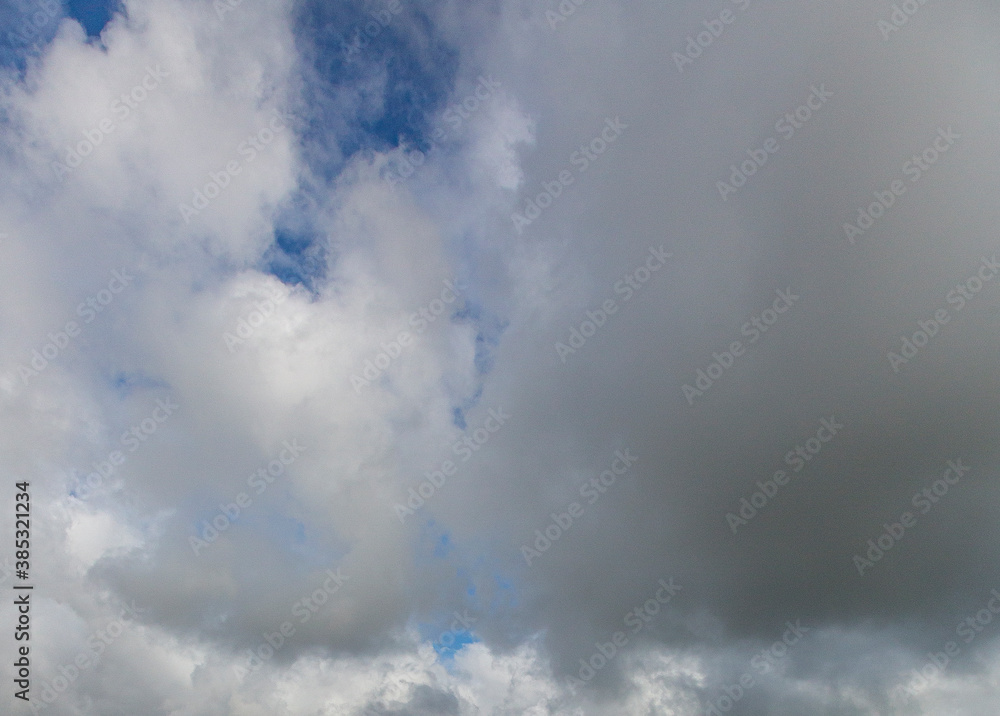 Image of a partly cloudy and partly clear sky during the day Image of a partly cloudy and partly clear sky during the day