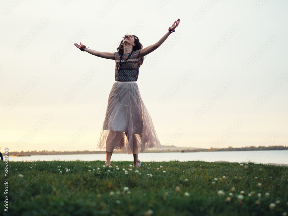Beautiful woman spending time at the lake after sunset Beautiful woman spending time at the lake after sunset