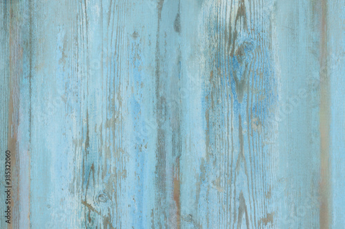 Watercolor blue wood background. Light blue wood texture of pine board with knots. Blue washed wood texture. Wood table top view.