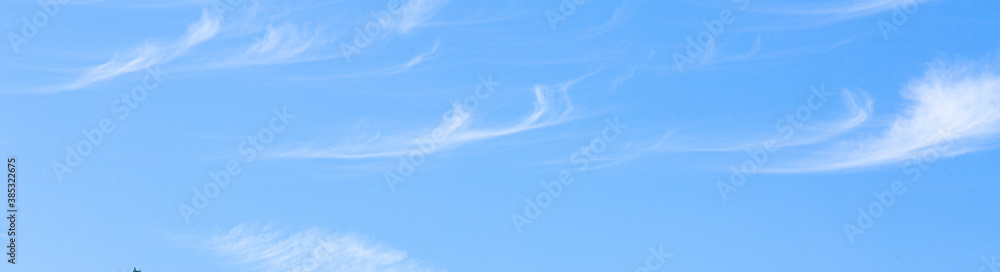 Image of a partly cloudy and partly clear sky during the day Image of a partly cloudy and partly clear sky during the day