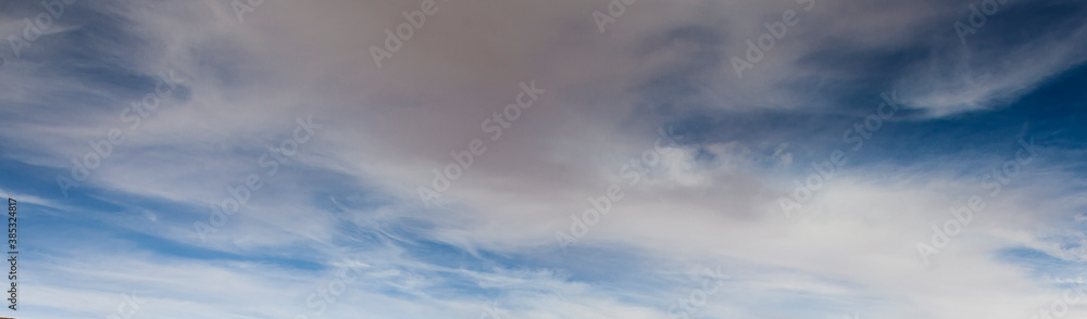 Image of a partly cloudy and partly clear sky during the day Image of a partly cloudy and partly clear sky during the day