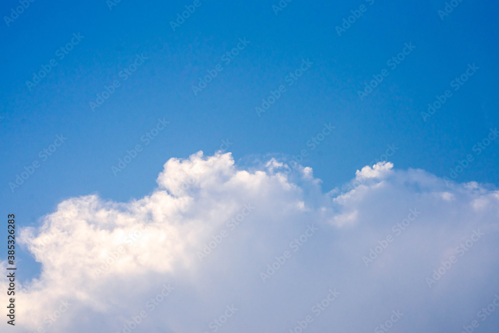 huge clouds float on the blue sky.	

