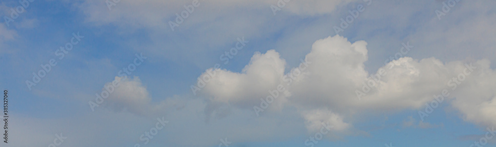 Image of a partly cloudy and partly clear sky during the day Image of a partly cloudy and partly clear sky during the day