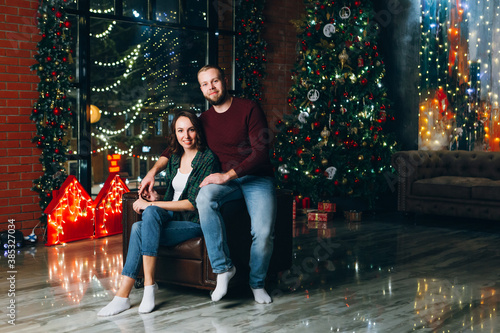 Cute young family husband and wife at the Christmas tree © irina_timokhina