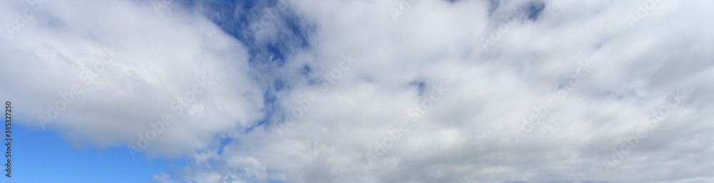 Image of a partly cloudy and partly clear sky during the day Image of a partly cloudy and partly clear sky during the day