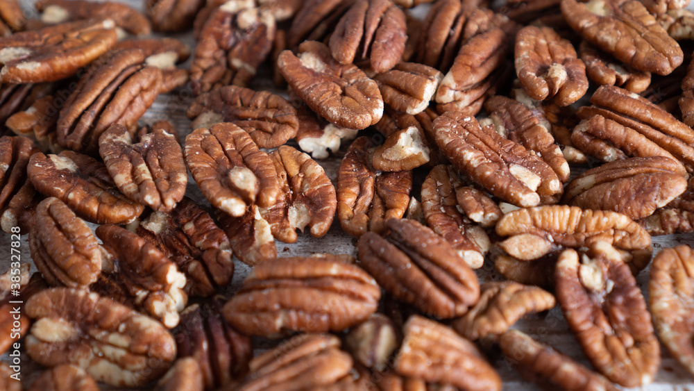 Pecan nuts background. Close up of healthy delicious pecan nuts for energy and healthy living Pecan nuts background. Close up of healthy delicious pecan nuts for energy and healthy living