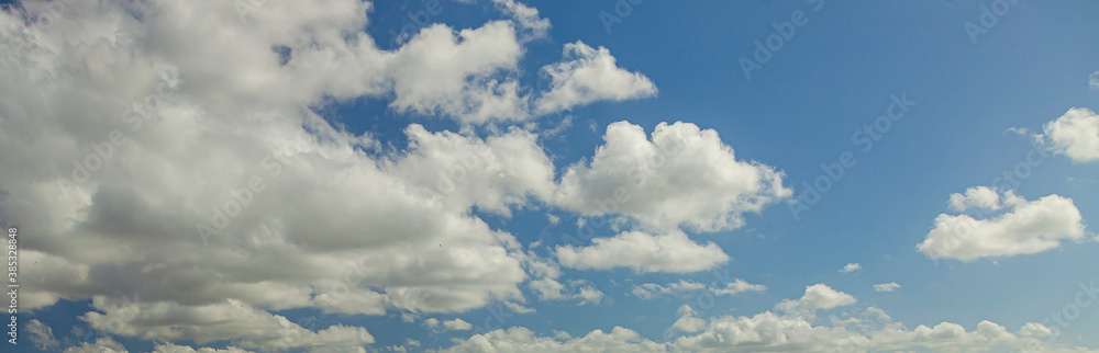 Image of a partly cloudy and partly clear sky during the day Image of a partly cloudy and partly clear sky during the day