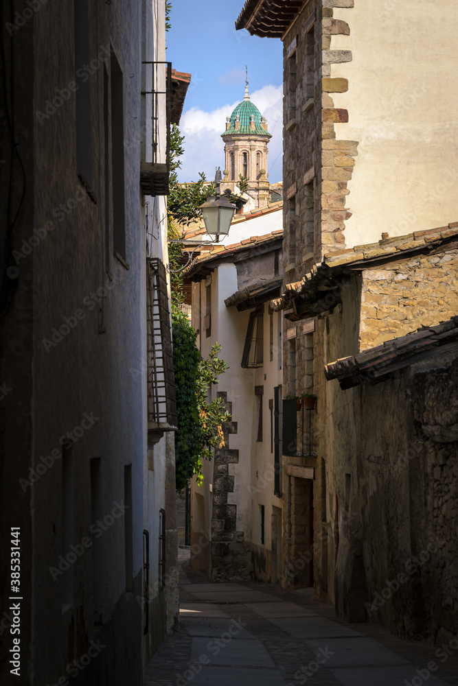 Rubielos de Mora street with the dome of the Church of the old Carmelite Convent standing out among the houses, Teruel, Spain