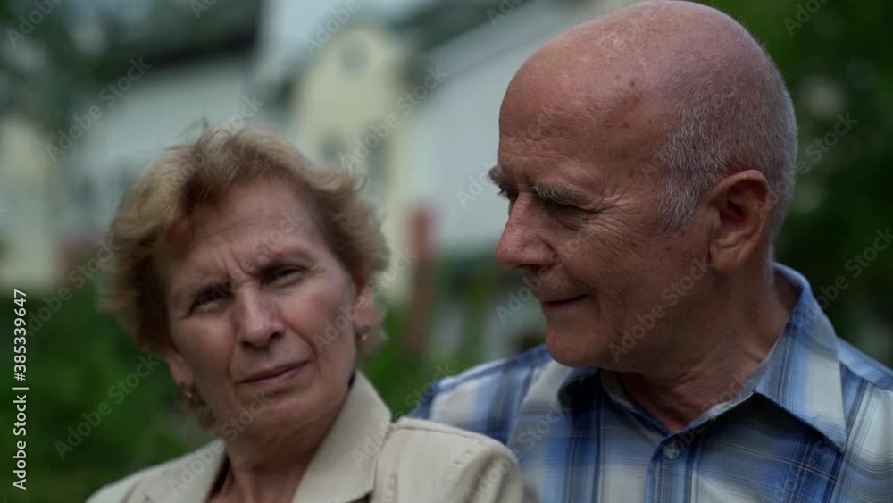 elderly spouses are smiling looking to each other, portrait of old man and woman elderly spouses are smiling looking to each other, portrait of old man and woman