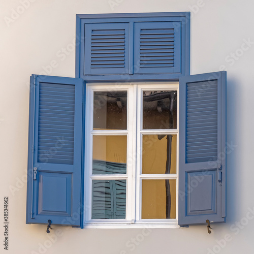 vintage blue shutters with white frame window  architectural detail