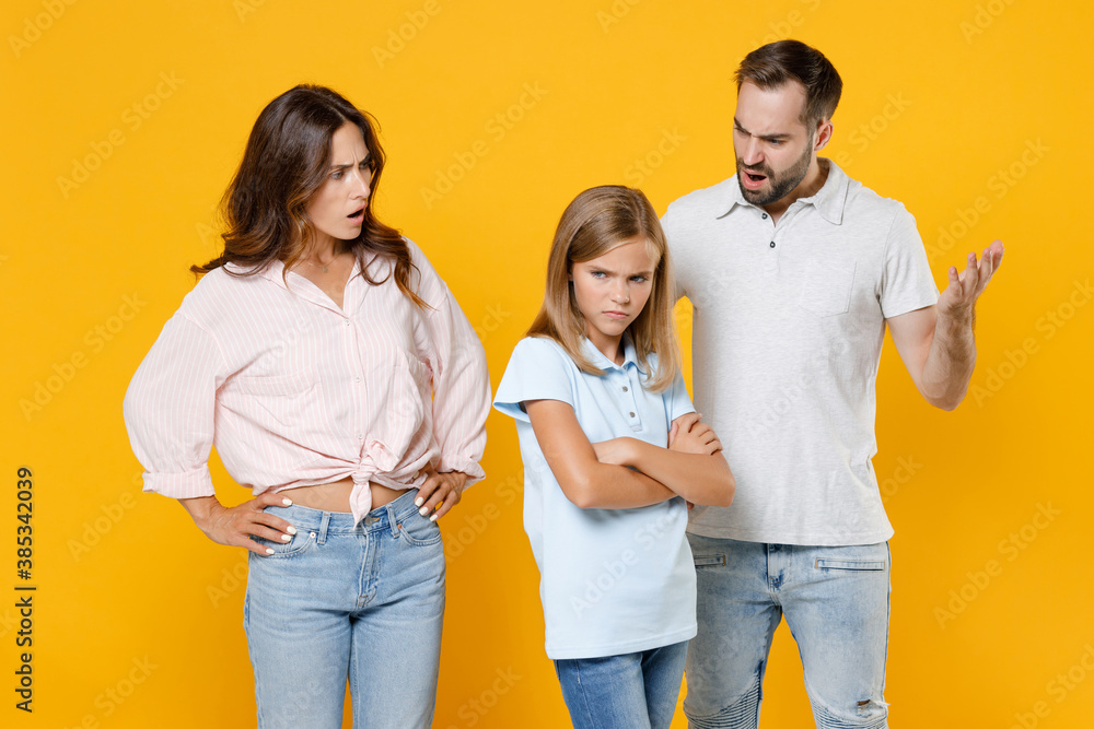Displeased offended young parents mom dad with child kid daughter teen ...