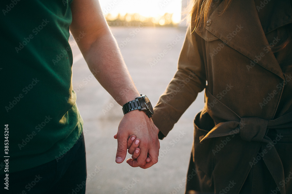 man and woman holding each other's hands, close-up, in nature, outdoors, hugs, tenderness man and woman holding each other's hands, close-up, in nature, outdoors, hugs, tenderness