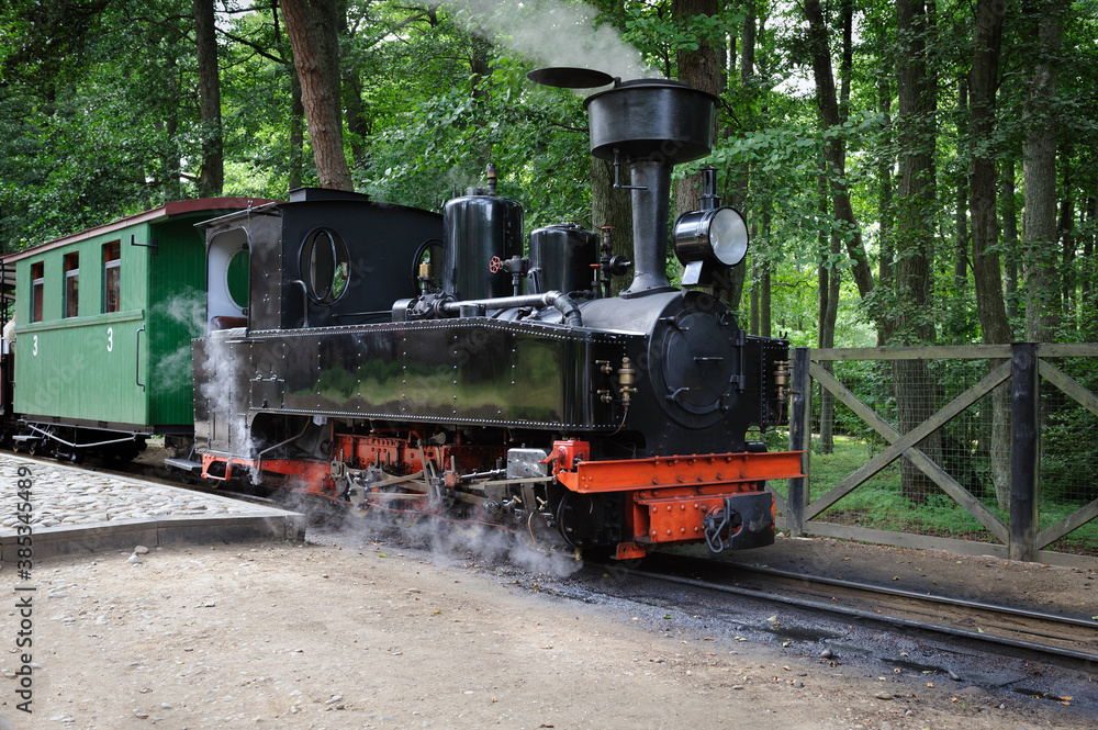 Old black steam locomotive is waiting for passengers. Ventspils, Latvia. Old black steam locomotive is waiting for passengers. Ventspils, Latvia.