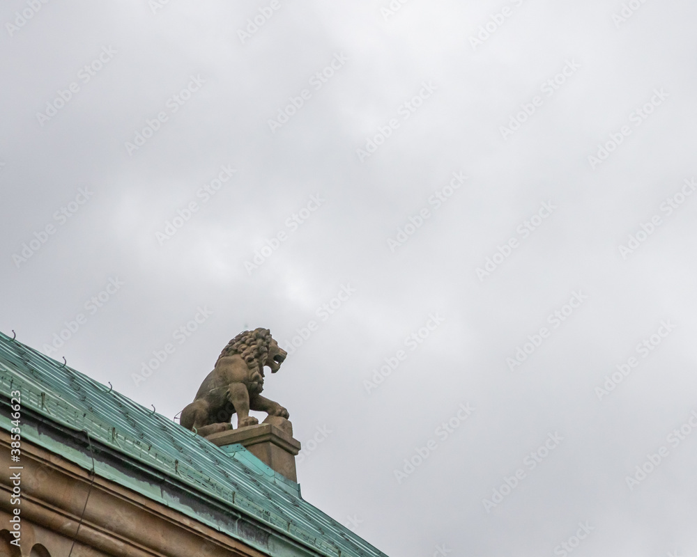 lion statue in front of a building