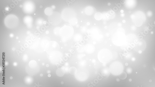 Gray abstract background. white light and snow bokeh for Christmas new year blurred beautiful shiny lights use wallpaper backdrop and your product.