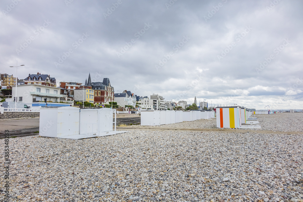 Beach and colored beach cabins on the Atlantic Ocean in Le Havre. Coastal town of Le Havre, Department Seine-Maritime, Haute-Normandie, France.