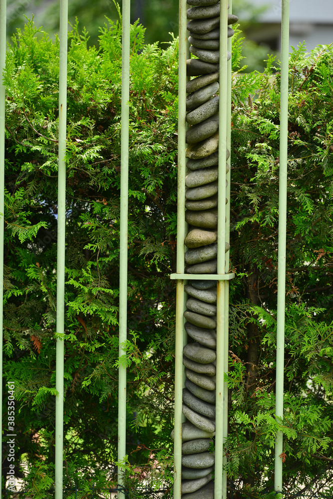Beautiful fence with stones in the park