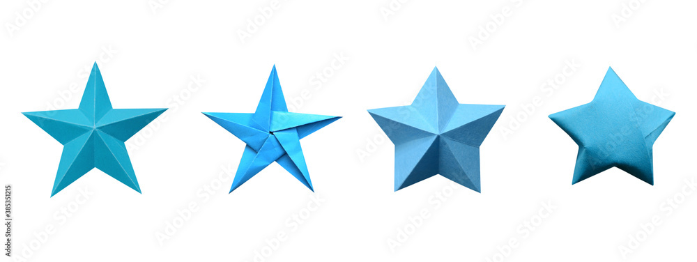 A blue origami star on wooden