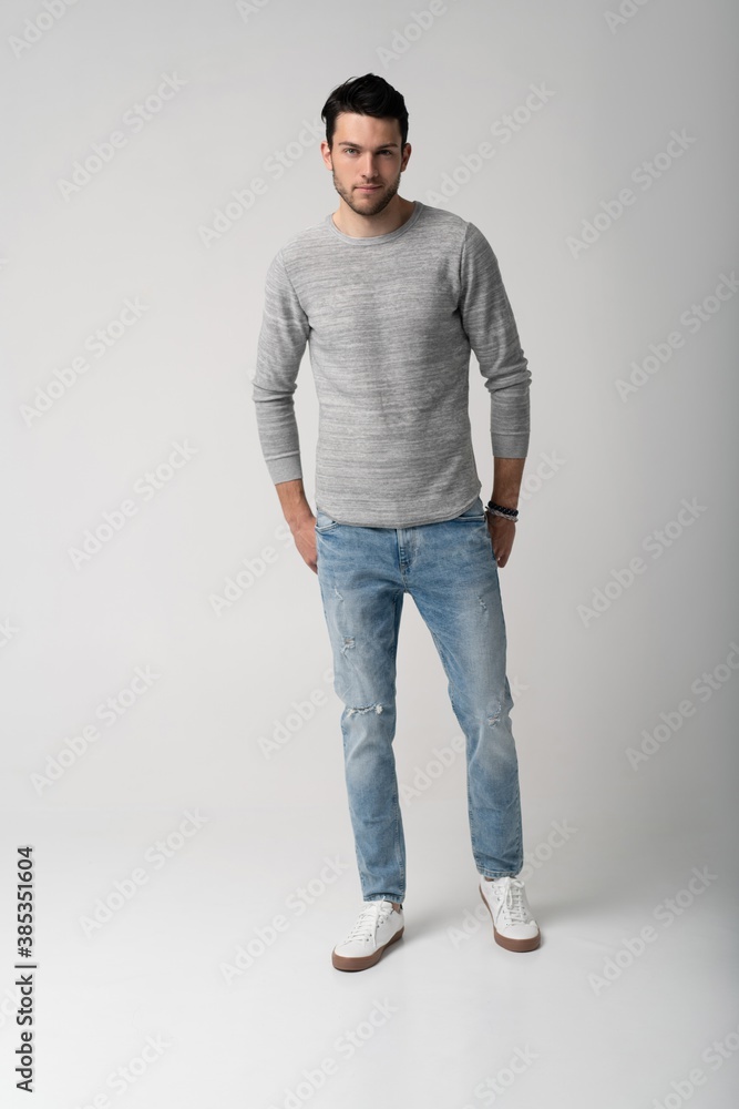 Handsome young man running or jumping in air on white background Handsome young man running or jumping in air on white background