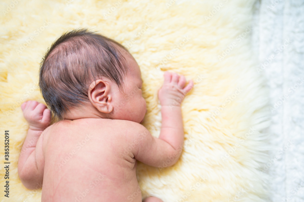 Newborn baby in costume sleeping on blanket Newborn baby in costume sleeping on blanket
