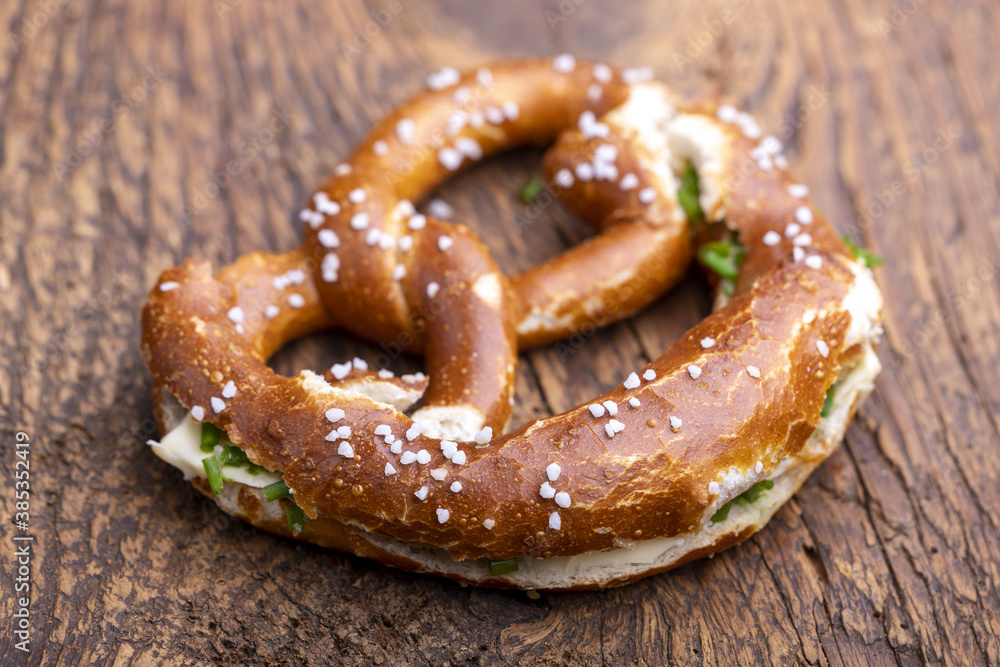 bavarian pretzel with butter on wood bavarian pretzel with butter on wood
