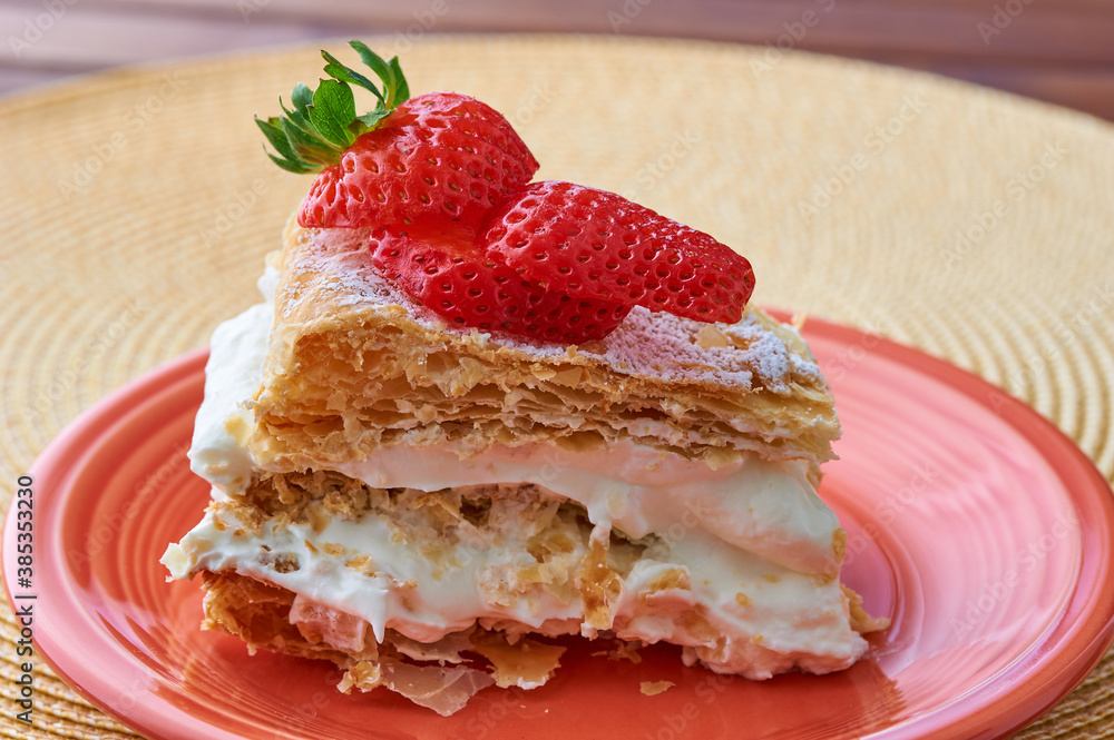 Tarta Milhojas in spanish - a pastry containing layers of puff pastry, pastry cream, strawberries, manjar and sugar. Also called mille feuilles or napoleon cake Tarta Milhojas in spanish - a pastry containing layers of puff pastry, pastry cream, strawberries, manjar and sugar. Also called mille feuilles or napoleon cake