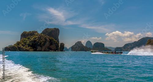 Longtailed speed boats cross in Phang Nga Bay in Thailand