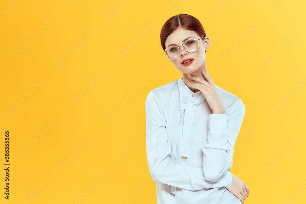 woman in white shirt wearing glasses red lips elegant style yellow isolated background woman in white shirt wearing glasses red lips elegant style yellow isolated background