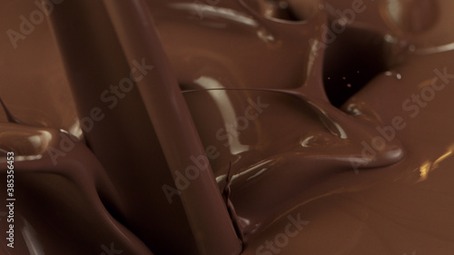 Detail of pouring hot chcocolate with splash