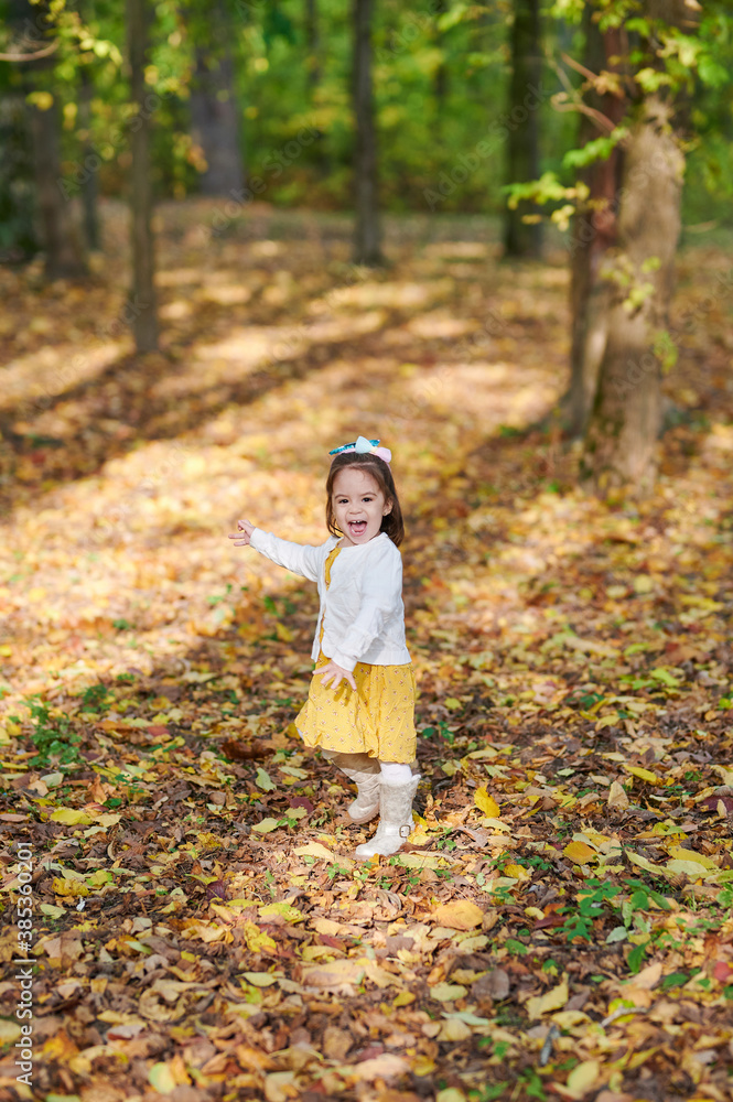 Happy screaming little girl in park Happy screaming little girl in park