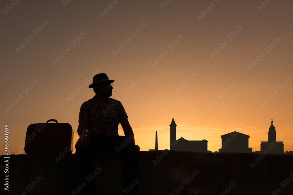 man in front of birmingham city skyline