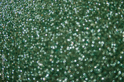 Unframed abstract background green glitter. sparkles