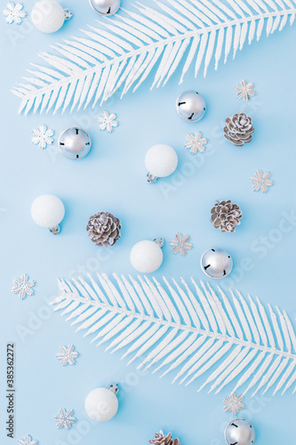 Flat lay pattern with christmas decorationon a blue background photo