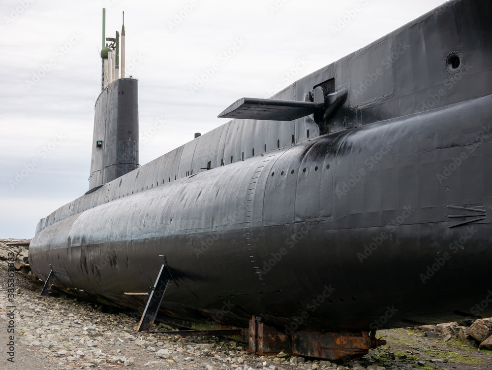 Obraz premium An old submarine exposed out of the water
