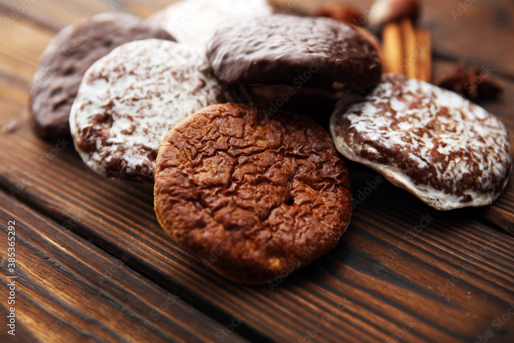 Typical German Gingerbreads such as Lebkuchen and Aachener Printen on rustic Typical German Gingerbreads such as Lebkuchen and Aachener Printen on rustic