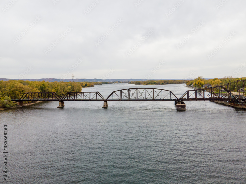 Swing Railroad bridge over the Mississippi River between Wisconsin and Minnesota during autumn