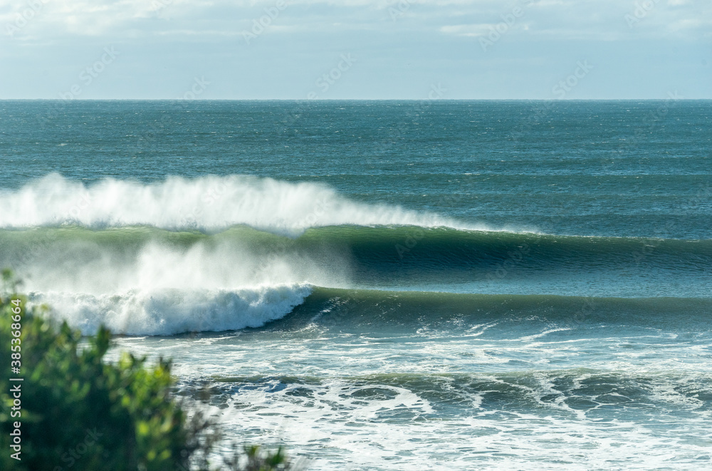 Fototapeta premium Waves rolling in on the Atlantic Ocean in New York. Photo was taken in Montauk, NY during after a Hurricane swell