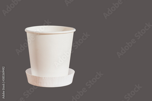 White disposable Cup on a uniform background