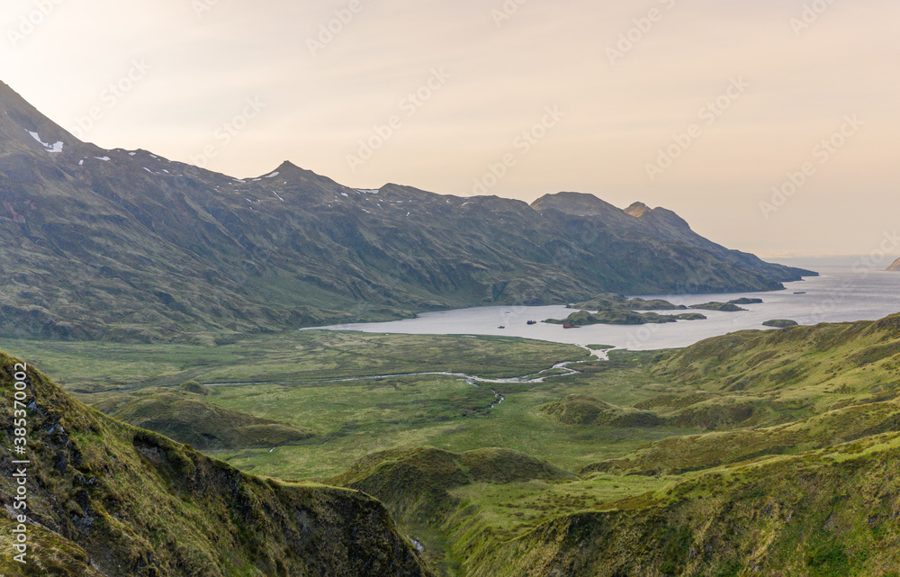 Aerial view of lush green grass in the bay of Unalaska, Alaska, USA. Aerial view of lush green grass in the bay of Unalaska, Alaska, USA.
