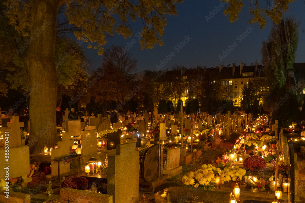 Endless grave lantern lights at cemetery in Poland Endless grave lantern lights at cemetery in Poland