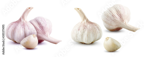 Fresh natural garlic cloves isolated on white background, full depth of field. Raw vegetable set design elements composition, focus stacking. Garlic bulb with segments, healthy food nutrition concept