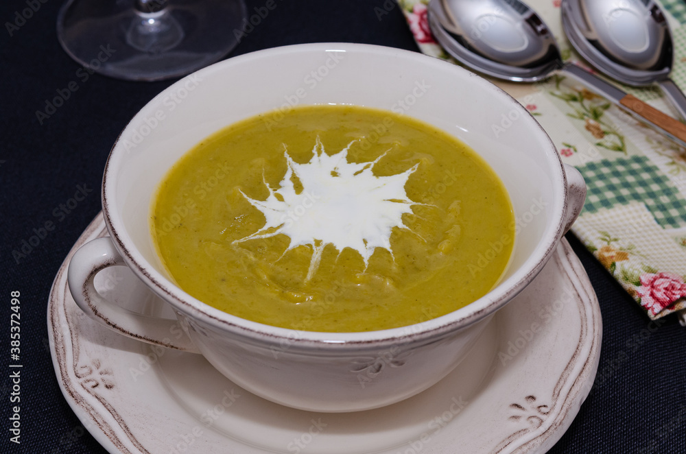 Broccoli cream soup in a bowl served with croutons Broccoli cream soup in a bowl served with croutons
