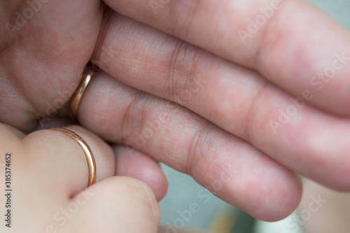 hands of a couple with their rings symbol of love