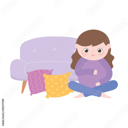 pregnancy and maternity, cute pregnant woman sitting in the floor with sofa and cushions